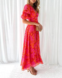 Robe longue rose imprimée à col en V