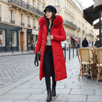 Manteau matelassé long à capuche bordée de fourrure