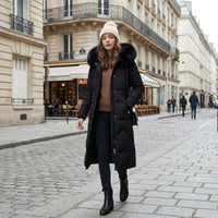 Manteau matelassé long à capuche bordée de fourrure