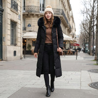 Manteau matelassé long à capuche bordée de fourrure