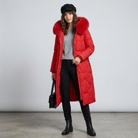 Manteau matelassé long à capuche bordée de fourrure