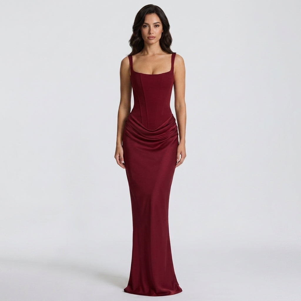 Women's long corset-style dress with adjustable straps and draped skirt