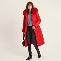 Manteau matelassé long à capuche bordée de fourrure